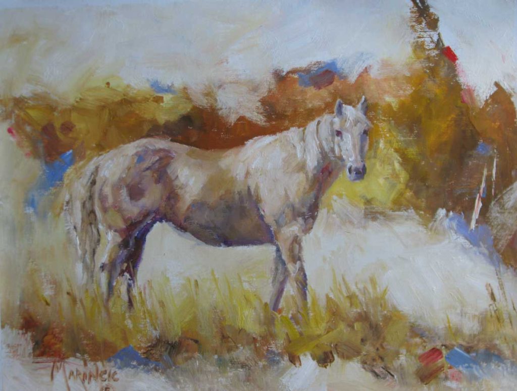 palomino horse in a fall setting